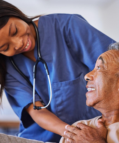 Healthcare professional assisting an elderly patient