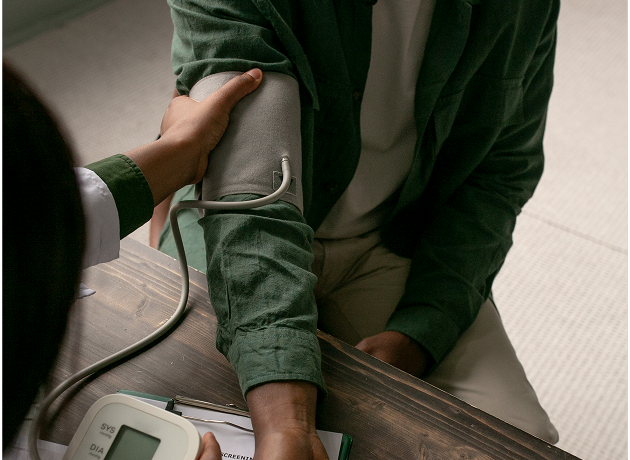 Healthcare professional checking a patient's blood pressure