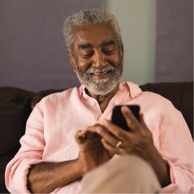Older man checking health updates on his mobile phone